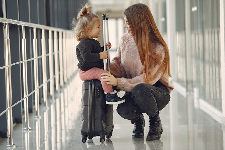 Mother and daughter with suitcase at airport ready for Thanksgiving family travel
