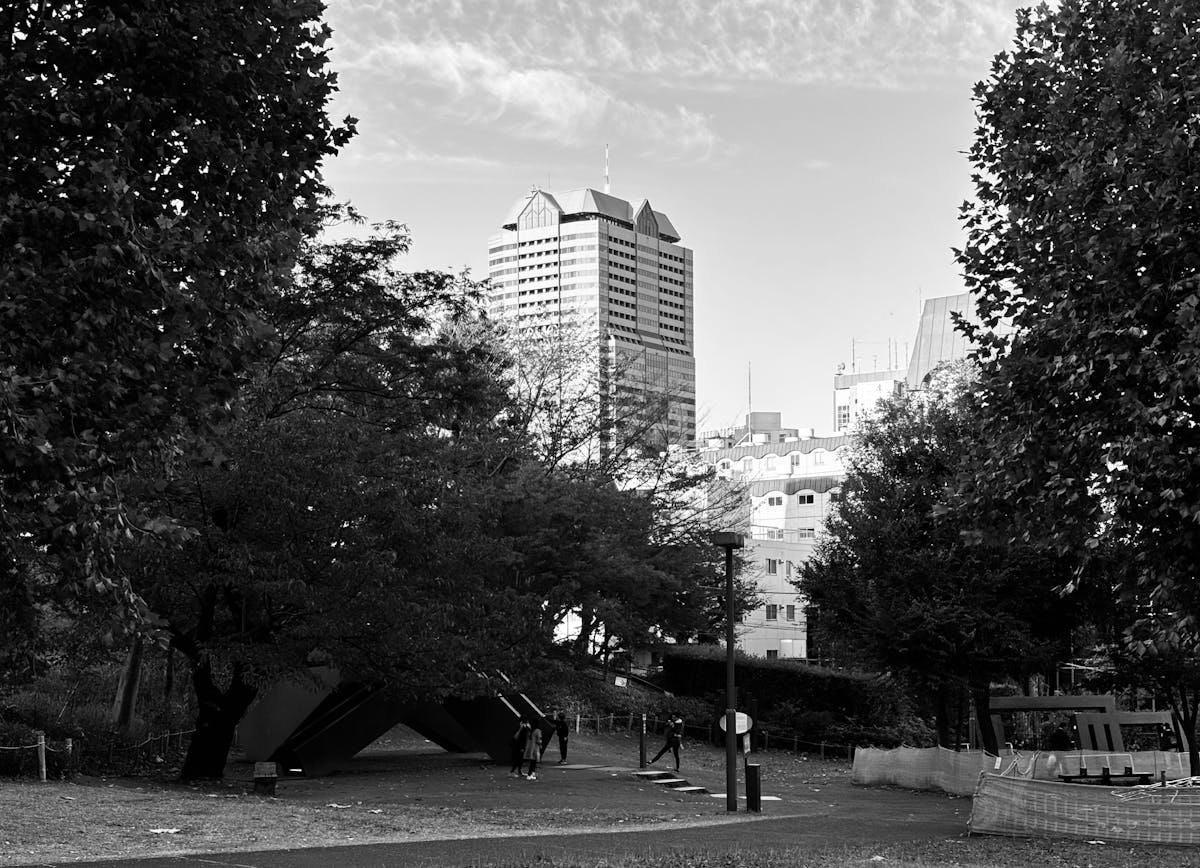 Tokyo city park with modern buildings and green space