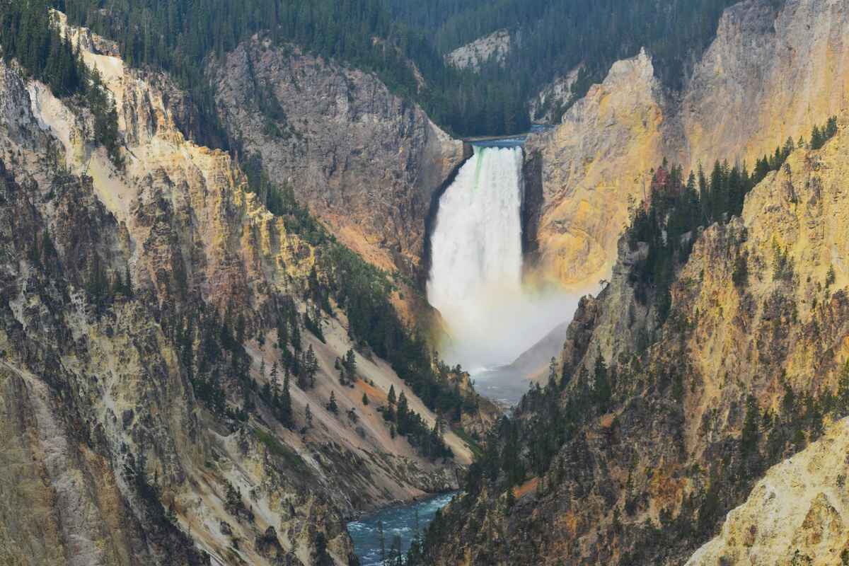 Lower Falls of the Yellowstone River cascading through Grand Canyon of Yellowstone, spectacular family sightseeing