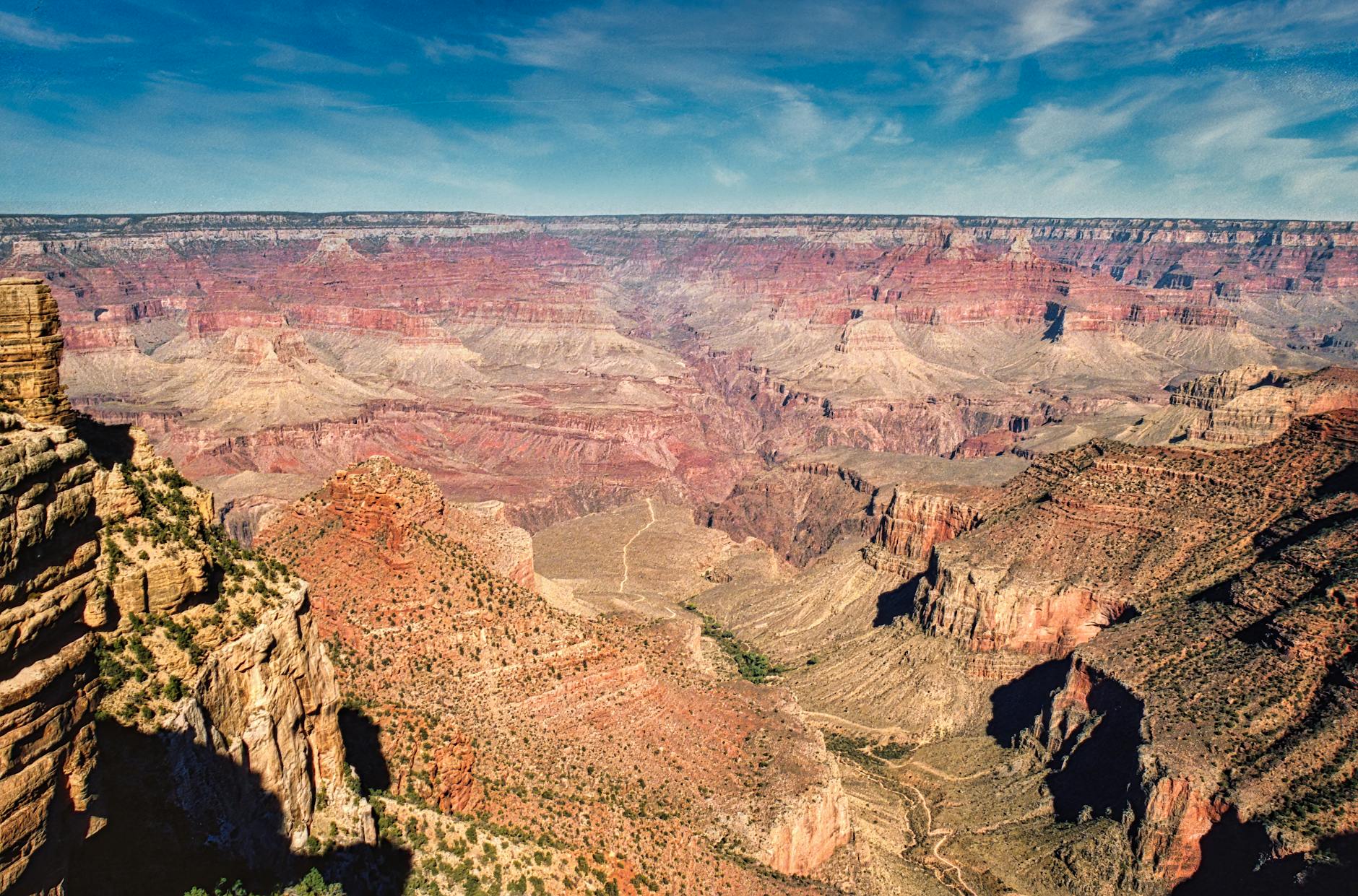 Grand Canyon panorama with eroded rock formations and warm earth tones at the South Rim