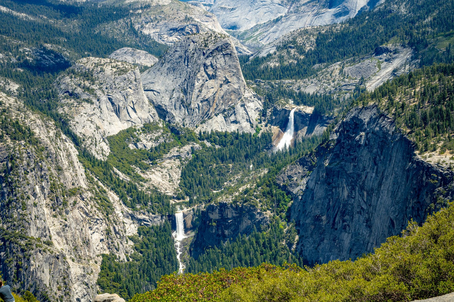 Family with young kids on a flat Yosemite Valley trail near a waterfall &mdash; the kind of low-effort, high-payoff walk that works for ages 6 and up